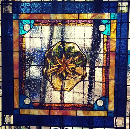 abstract stained-glass panel in orange and blue motif