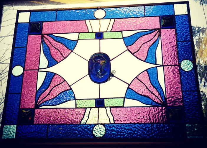 Abstract stained-glass panel in predominantly fuschia and cobalt